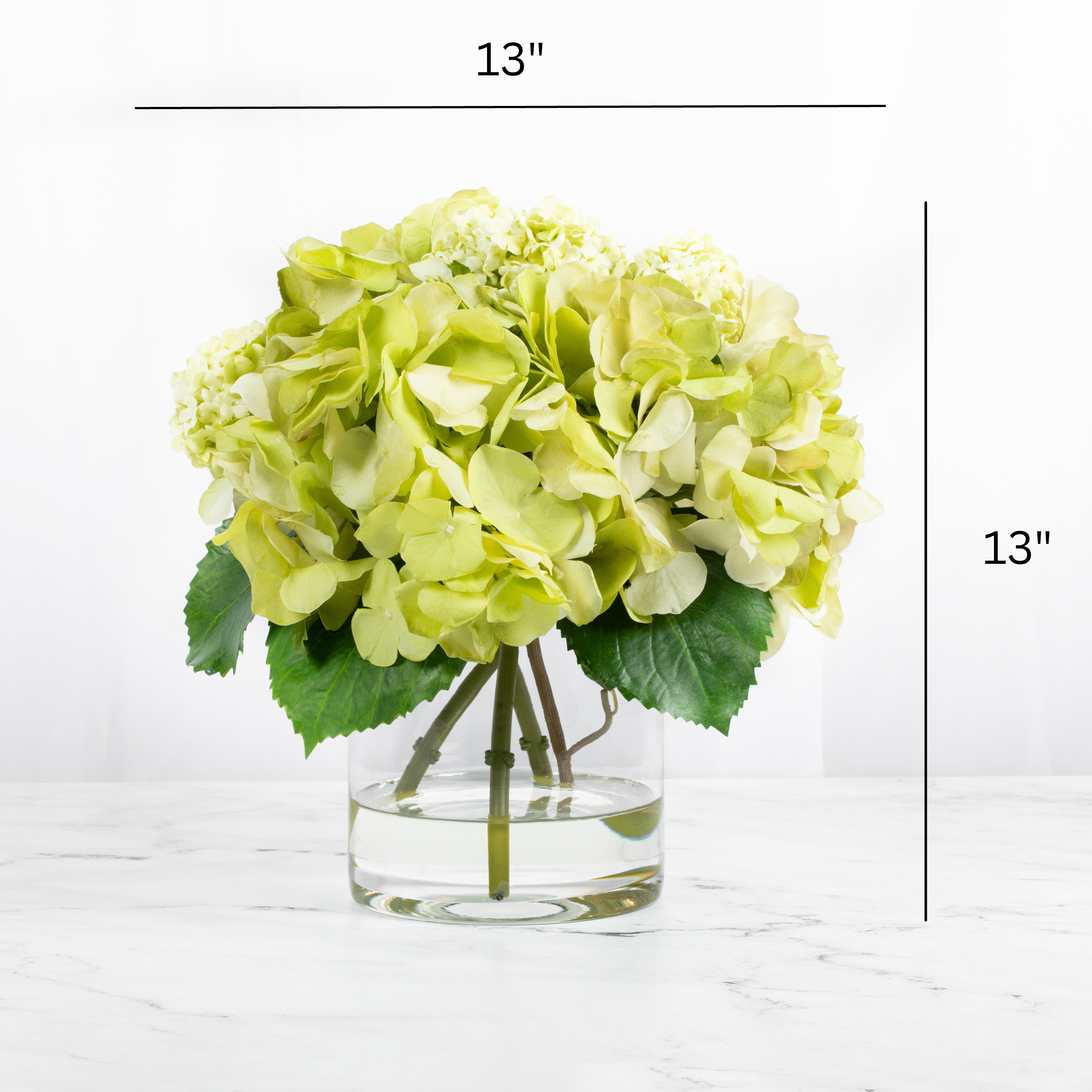 Silk hydrangea centerpiece arrangement in glass vase